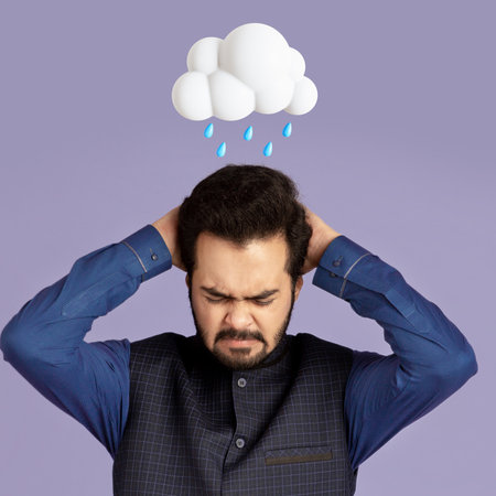 Despaired tired millennial hindu male suffer from pain, migraine and problems with abstract cloud and rain signの写真素材