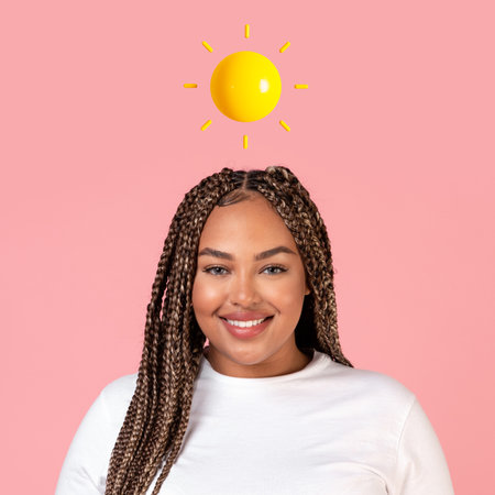 Happy millennial african american plus size female with abstract sun above her headの写真素材