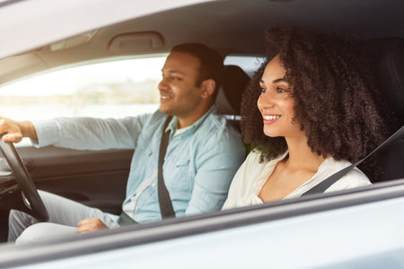 Happy Middle Eastern Car Owners Couple Enjoying Ride In Auto