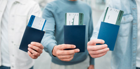 Three Unrecognizable Men Showing Passports With Boarding Passes, Closeupの写真素材