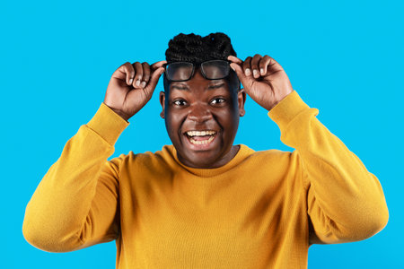 Wow. Black Guy Taking Off Glasses And Looking At Camera With Excitement