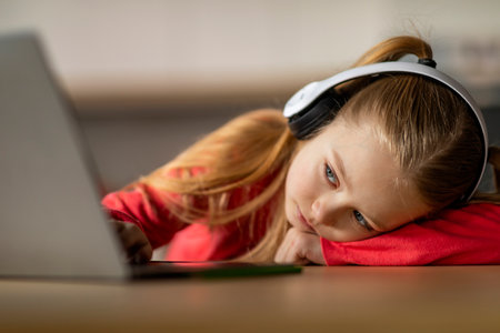 Burnout In Children. Upset Little Girl Looking At Laptop Screen