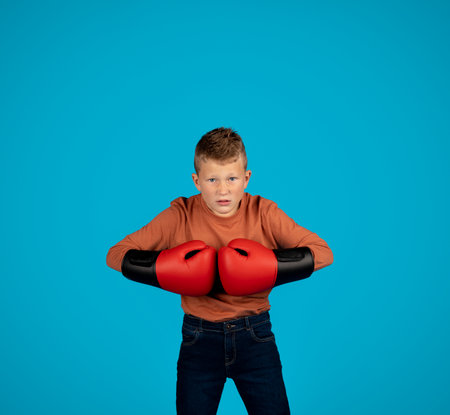 Aggressive Little Boy Wearing Boxing Gloves Putting Hands Together