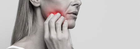 Cropped of woman suffering from strong tooth pain, closeup