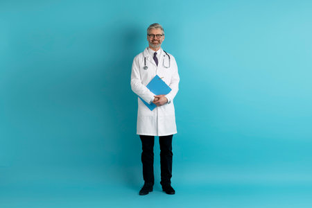 Full length studio shot of middle aged european doctorの写真素材