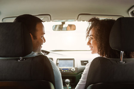Middle Eastern Spouses Driving Sitting In Vehicle, Back Viewの写真素材