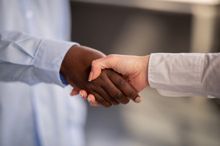 Closeup Shot Of Handshake Symbolizing Diversity And Cooperation Indoors