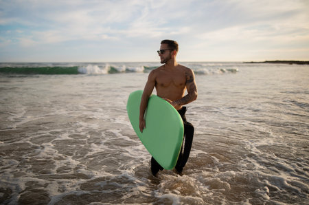 Handsome Muscular Guy Surfing Alone On Ocean Shore