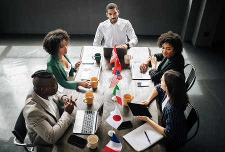 Diverse Businessmen And Businesswomen Having Corporate Meeting In Modern Officeの写真素材