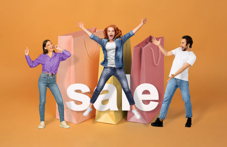 Customers Posing With Word Sale And Shopper Bags, Orange Backgroundの写真素材
