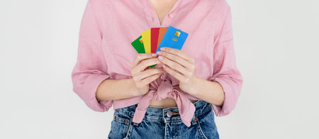 Cropped of woman holding bank cards in her handsの写真素材