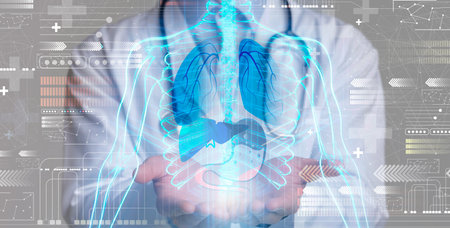 Cropped of man doctor holding hologram of human body, collageの写真素材