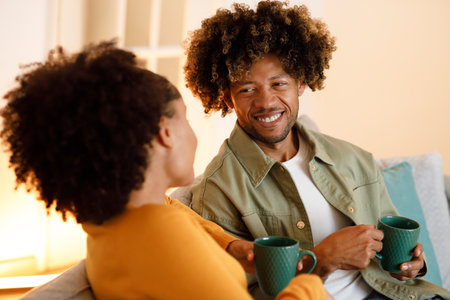 African Spouses Bonding Over Coffee and Flirty Talks At Homeの写真素材