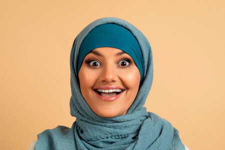 Big Surprise. Joyful Muslim Woman In Hijab Looking At Camera With Excitementの写真素材