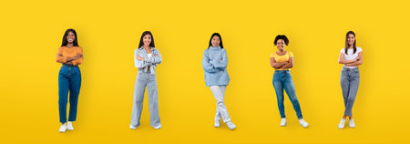 Happy multiethnic millennial ladies posing on yellow background, web-banner
