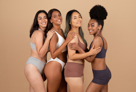 Diverse young ladies in underwear, embracing natural beautyの写真素材