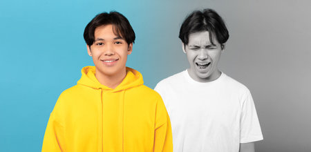 Happy, despaired and unhappy millennial asian man suffer from depression, cryの写真素材