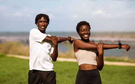Healthy Lifestyle Concept. Happy black millennial couple training together outdoorsの写真素材