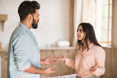 Young Hindu spouses in heated discussion at homeの写真素材