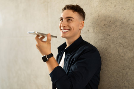 Happy handsome millennial european guy enjoy lifestyle, calling by smartphone