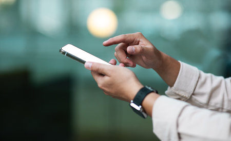Unrecognizable businessman holding modern smartphone with white blank screen