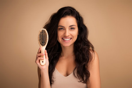 Woman removes makeup from the face with a cotton swabの写真素材
