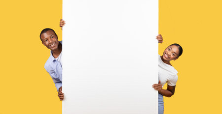 Black spouses with large blank poster, bannerの写真素材