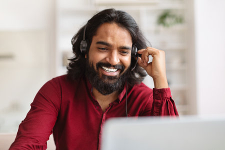 Customer Support Manager Man In Headset Working With Laptop Computerの写真素材