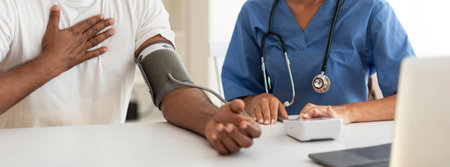 Doctor Woman Measuring Arterial Blood Pressure Of Male Patient In Clinic, Croppedの写真素材