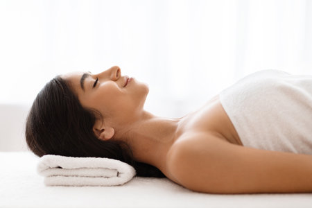 Beautiful Indian Lady Resting Before Beauty Treatment In Spaの写真素材