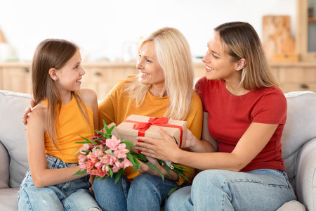 Family celebrating Mothers Day with gifts at home