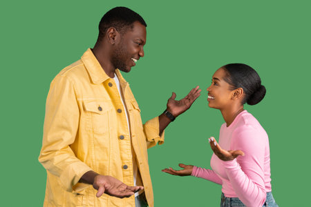 Funny cute african american man and woman have conversationの写真素材