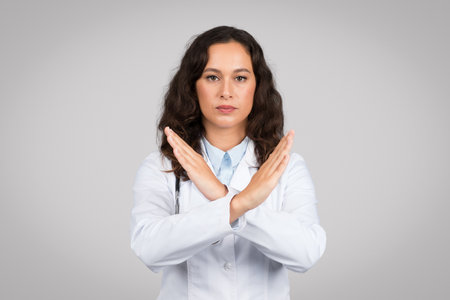 Doctor woman making no sign with her arms crossedの写真素材