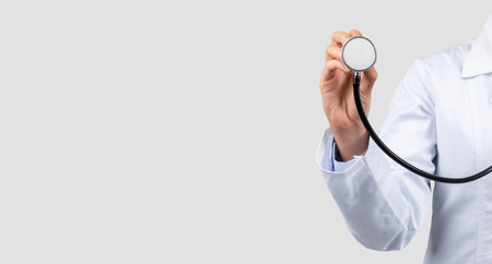 A cropped image of a doctors hand holding a stethoscopeの写真素材