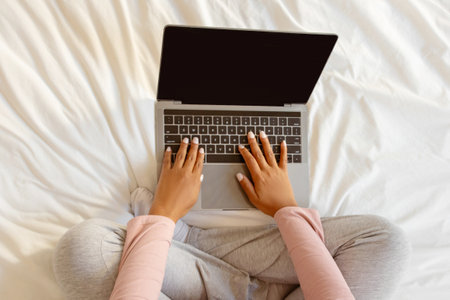 Unrecognizable Black Pregnant Woman Using Laptop With Empty Blank Screen