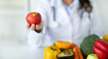 Nutritionist desk with healthy fruit and vegetableの写真素材