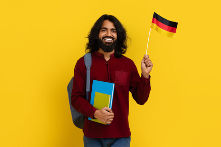 Positive eastern young man studying German at universityの写真素材