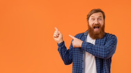 Funny Emotional Guy With Red Hair Pointing Fingers Aside, Studioの写真素材