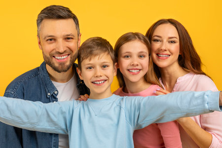 Close-up of a family hug with kidsの写真素材