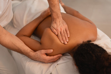 Male therapist giving a deep tissue massage