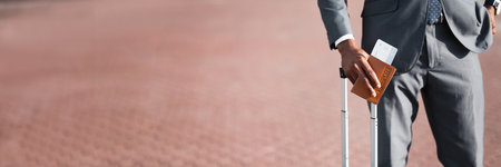 African Businessman Holding Passport With Tickets, Cropの写真素材