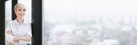 Joyful Lady Crossing Hands Standing Near Panoramic Window In Office