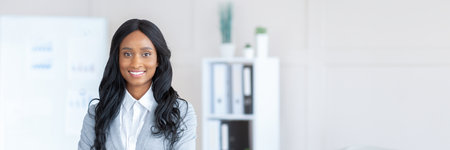 Portrait of friendly black lady manager in formal suitの写真素材