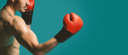 Strong Boxer Posing on Blue Background, Croppedの写真素材