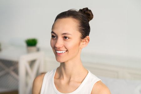 Woman Smiling With Hair in Bunの写真素材