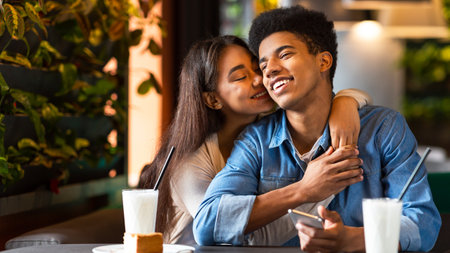 Guy and Girl Hugging in a Restaurantの写真素材