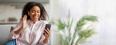 Smiling Woman Video Chatting on Smartphone Indoors