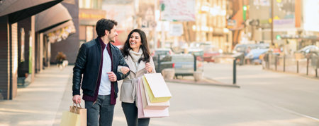 Couple Walking Down the Street With Shopping Bags