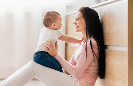 Mother and Baby Bonding in Bright Modern Kitchen During Daytime