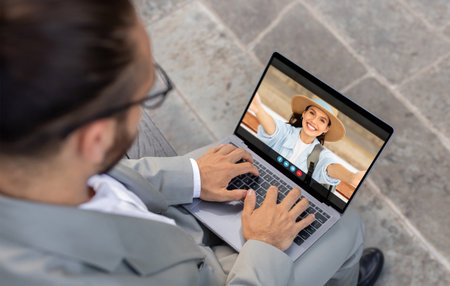 Man Video Chatting With Woman On Laptop Outdoors During Day